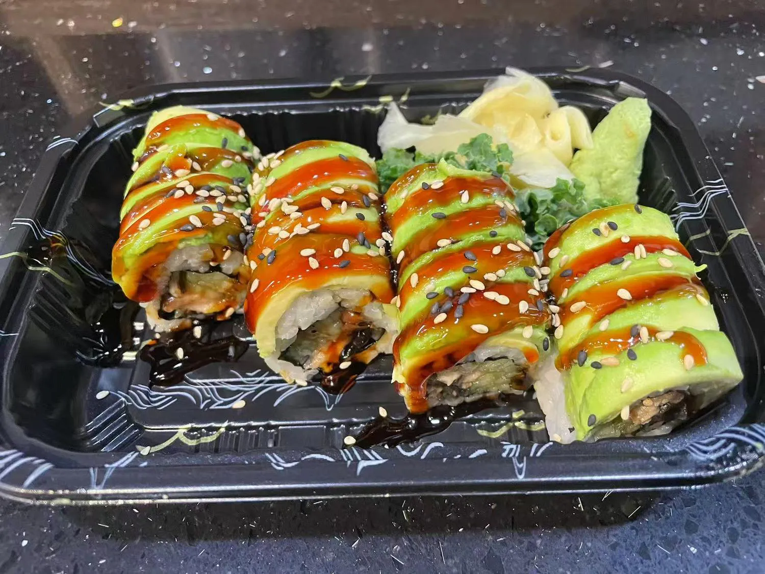 Avocado sushi roll with eel sauce and sesame seeds at Kumo Sushi & Hibachi, a Japanese Restaurant in Alachua